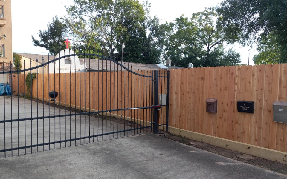 Content 1 Iron wrought fence and wooden fence Wood Fence near Houston, TX
